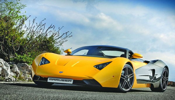 Марусия е име, познато на последователите на F1, след като пое отбора на Virgin Racing. През 2008 г. руската марка разкри своя суперавтомобил - B1, кола, планирана да грабне купувачите на Ferrari 458. Нещата станаха малко странни при избора на двигател. В базова форма той е с 3,5-литров V6 с 300 к.с., въпреки че 2,8-литров Turbo V6 се предлага в две версии: 306 к.с. и 420 к.с.

Теглото беше само 1100 кг , надминавайки съотношението мощност/тегло на 458. Моделът B2 пристигна през 2009 г., но компанията  фалира през 2014 г. със само 12 продадени коли B2.
